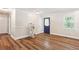 Spacious living room with hardwood floors, neutral paint, and natural light at 4825 Rollins Dr, Powder Springs, GA 30127