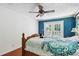 Bedroom features hardwood floors, bright windows, and blue walls with French doors to the back at 4825 Rollins Dr, Powder Springs, GA 30127