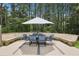 Outdoor dining and seating area on wooden deck with wooded views at 4825 Rollins Dr, Powder Springs, GA 30127