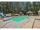Backyard features a large in-ground pool and spacious deck for entertaining at 4825 Rollins Dr, Powder Springs, GA 30127