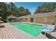 Backyard pool featuring an expansive patio, diving board, and a gazebo at 4825 Rollins Dr, Powder Springs, GA 30127