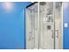 Updated shower features frameless glass doors and modern fixtures at 4825 Rollins Dr, Powder Springs, GA 30127