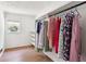 Walk-in closet with built-in shelves and plenty of space for hanging clothes at 4825 Rollins Dr, Powder Springs, GA 30127