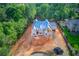 Expansive lot featuring a new construction home with advanced roof in a serene wooded neighborhood at 2808 Carson Garrett Ct, Buford, GA 30519