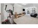 Finished basement gym with exercise equipment and entertainment area at 3445 Henderson Dr, Cumming, GA 30041