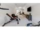 Finished basement gym with a TV, exercise equipment, and comfortable seating area at 3445 Henderson Dr, Cumming, GA 30041