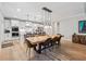 Elegant dining area with stylish lighting and seating for eight at 3445 Henderson Dr, Cumming, GA 30041