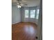 Comfortable bedroom boasts a ceiling fan and abundant natural light through large windows at 72 Victorian Cir, Dallas, GA 30157