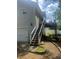 Exterior view with a stairway leading to an upper-level deck, blending architectural design with outdoor access at 72 Victorian Cir, Dallas, GA 30157