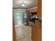 Well-lit kitchen features stainless steel appliances and warm wooden cabinetry for a cozy feel at 72 Victorian Cir, Dallas, GA 30157