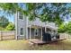 Backyard with deck, grill, and covered patio at 870 Underhill Ct, Sugar Hill, GA 30518