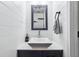 Stylish powder room with shiplap walls, modern vanity, rectangular mirror and sleek fixtures at 870 Underhill Ct, Sugar Hill, GA 30518