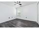 Bedroom with gray wood floors and ceiling fan at 870 Underhill Ct, Sugar Hill, GA 30518