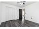 Bedroom with gray wood floors and closet at 870 Underhill Ct, Sugar Hill, GA 30518