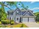 Charming two-story home featuring a well-maintained lawn and a two-car garage at 870 Underhill Ct, Sugar Hill, GA 30518