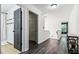 Hallway with tile floors and access to multiple rooms creates a smooth transition throughout the house at 870 Underhill Ct, Sugar Hill, GA 30518