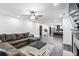 Spacious living room featuring hardwood floors, a ceiling fan, and an open floor plan at 870 Underhill Ct, Sugar Hill, GA 30518