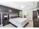 Spacious primary bedroom suite featuring a ceiling fan, modern floors and plenty of natural light at 870 Underhill Ct, Sugar Hill, GA 30518