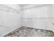 Spacious walk-in closet with built-in shelving offering plenty of storage options at 870 Underhill Ct, Sugar Hill, GA 30518