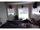 This bedroom has two windows, blinds, carpet, personal items, and could be the ideal place to rest at 2814 Shellbark Rd, Decatur, GA 30035