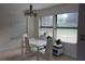 Bright dining room with modern white table and chairs, and natural light at 2814 Shellbark Rd, Decatur, GA 30035