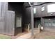 Rustic condo exterior with weathered wood, covered porch, and natural surroundings at 2814 Shellbark Rd, Decatur, GA 30035