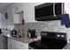 Modern kitchen features stainless steel appliances, granite counters, and a stylish backsplash at 2814 Shellbark Rd, Decatur, GA 30035