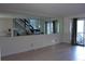 Living room featuring tile floors, large mirror, and a sliding glass door leading to an outdoor space at 2814 Shellbark Rd, Decatur, GA 30035