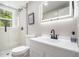 Bright bathroom featuring a modern vanity, LED mirror, walk-in shower, and neutral finishes at 479 Charter Oak Sw Dr, Atlanta, GA 30331