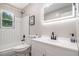 Bathroom featuring a shower-tub combo, LED mirror, stylish fixtures, and neutral finishes at 479 Charter Oak Sw Dr, Atlanta, GA 30331