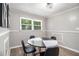 Dining area with a contemporary black and white table, modern decor, and a bright, sunlit window at 479 Charter Oak Sw Dr, Atlanta, GA 30331