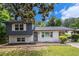 Charming two-story home boasts a white brick foundation and blue siding with a well-maintained lawn at 479 Charter Oak Sw Dr, Atlanta, GA 30331
