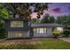 Charming split-level home with painted brick, dark siding, and a well-maintained lawn, perfect for suburban living at 479 Charter Oak Sw Dr, Atlanta, GA 30331