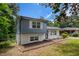Two-story home with a mixture of blue siding and white brick exterior, showcasing a cozy residential setting at 479 Charter Oak Sw Dr, Atlanta, GA 30331