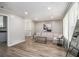 Bright living room features sleek floors, a modern couch, and ample natural light from a large window at 479 Charter Oak Sw Dr, Atlanta, GA 30331