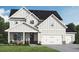 New construction home features a board and batten facade, stone accents, and a two-car garage at 613 Villa Rica Spgs, Villa Rica, GA 30180