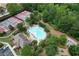 Aerial view of community pool, clubhouse and tennis courts surrounded by lush landscaping at 613 Villa Rica Spgs, Villa Rica, GA 30180