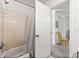 This bright bathroom with a tub/shower combo has a neutral color scheme at 1424 Tuxworth Cir, Decatur, GA 30033
