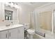 Well-lit bathroom featuring a combined shower and tub, modern vanity with a white cabinet, and tiled floors at 1424 Tuxworth Cir, Decatur, GA 30033