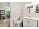 This neutral bathroom has light tile, a modern vanity, and essential fixtures at 1424 Tuxworth Cir, Decatur, GA 30033