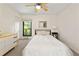 Bright bedroom features neutral decor, a ceiling fan, a window and closet at 1424 Tuxworth Cir, Decatur, GA 30033