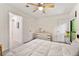 Comfortable bedroom features neutral carpet, bright walls and a ceiling fan at 1424 Tuxworth Cir, Decatur, GA 30033