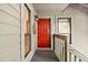 Apartment with bright red front door, gray railing, and covered entryway at 1424 Tuxworth Cir, Decatur, GA 30033