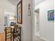 Hallway featuring decorative paintings, a table with a wine rack, and access to other rooms at 1424 Tuxworth Cir, Decatur, GA 30033