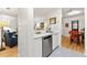 Bright, modern kitchen with stainless steel appliances, white cabinetry, and tile flooring at 1424 Tuxworth Cir, Decatur, GA 30033