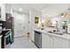 Kitchen with stainless steel appliances, white cabinetry, and seamless access to other living spaces at 1424 Tuxworth Cir, Decatur, GA 30033