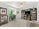 Inviting living room with natural light, a large built-in bookcase, and a comfortable chair at 1424 Tuxworth Cir, Decatur, GA 30033