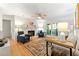 Cozy living room with hardwood floors, a brick fireplace, ceiling fan, and access to a private balcony at 1424 Tuxworth Cir, Decatur, GA 30033