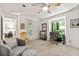 Well-lit living room features a desk area, comfortable seating, and neutral decor at 1424 Tuxworth Cir, Decatur, GA 30033
