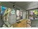 This covered patio features a dolphin statue, seating and backyard views at 1424 Tuxworth Cir, Decatur, GA 30033
